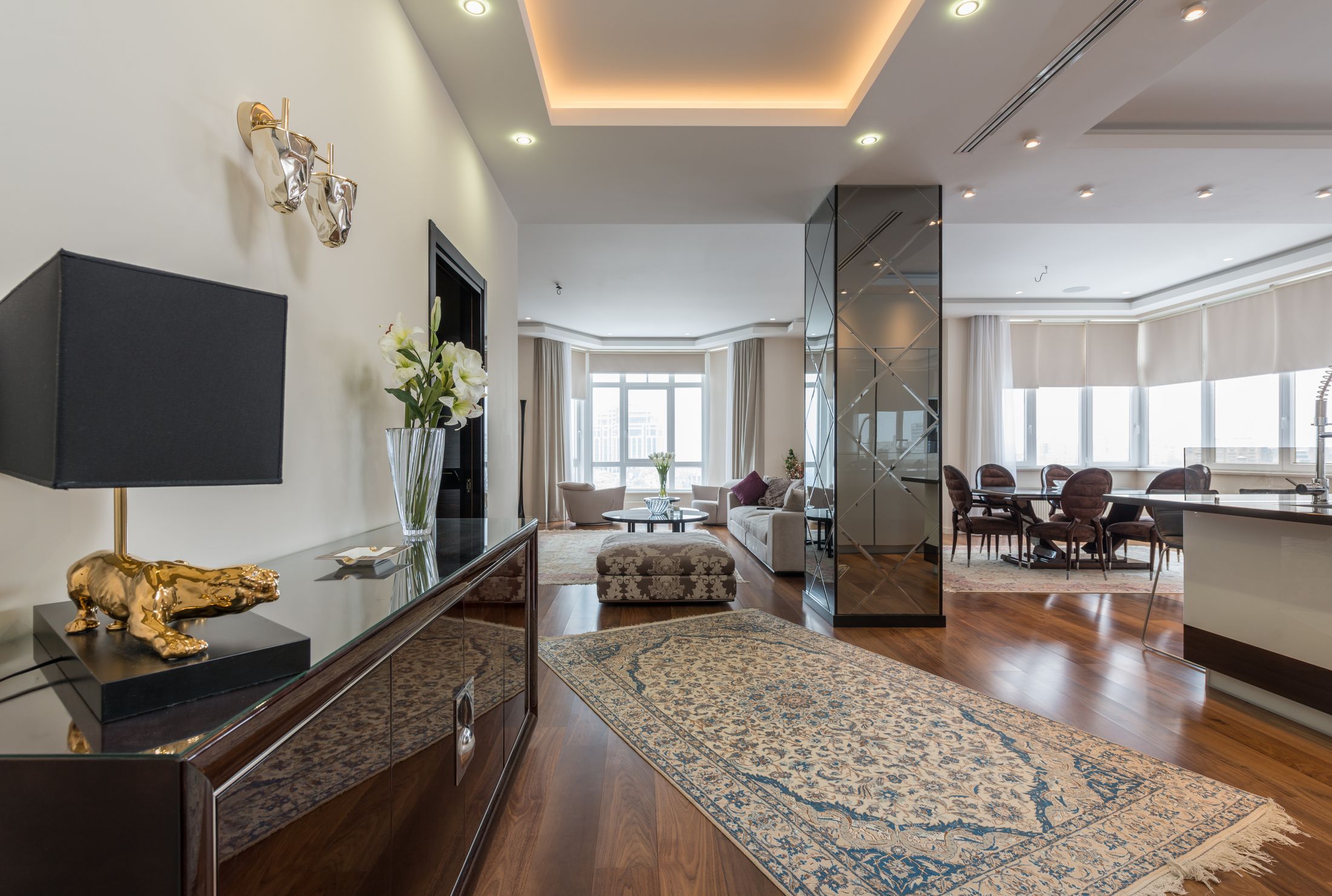 Illustrative luxury apartment with warm wood floors and elegant furnishings